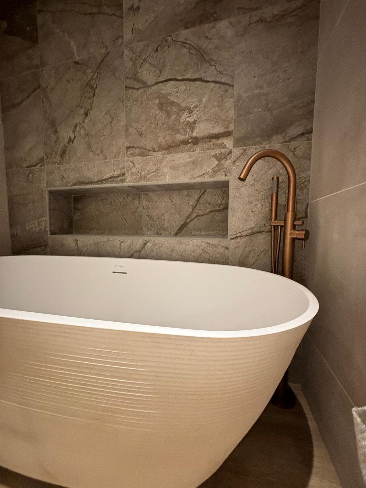 Contemporary ensuite bathroom with bespoke black concrete sink