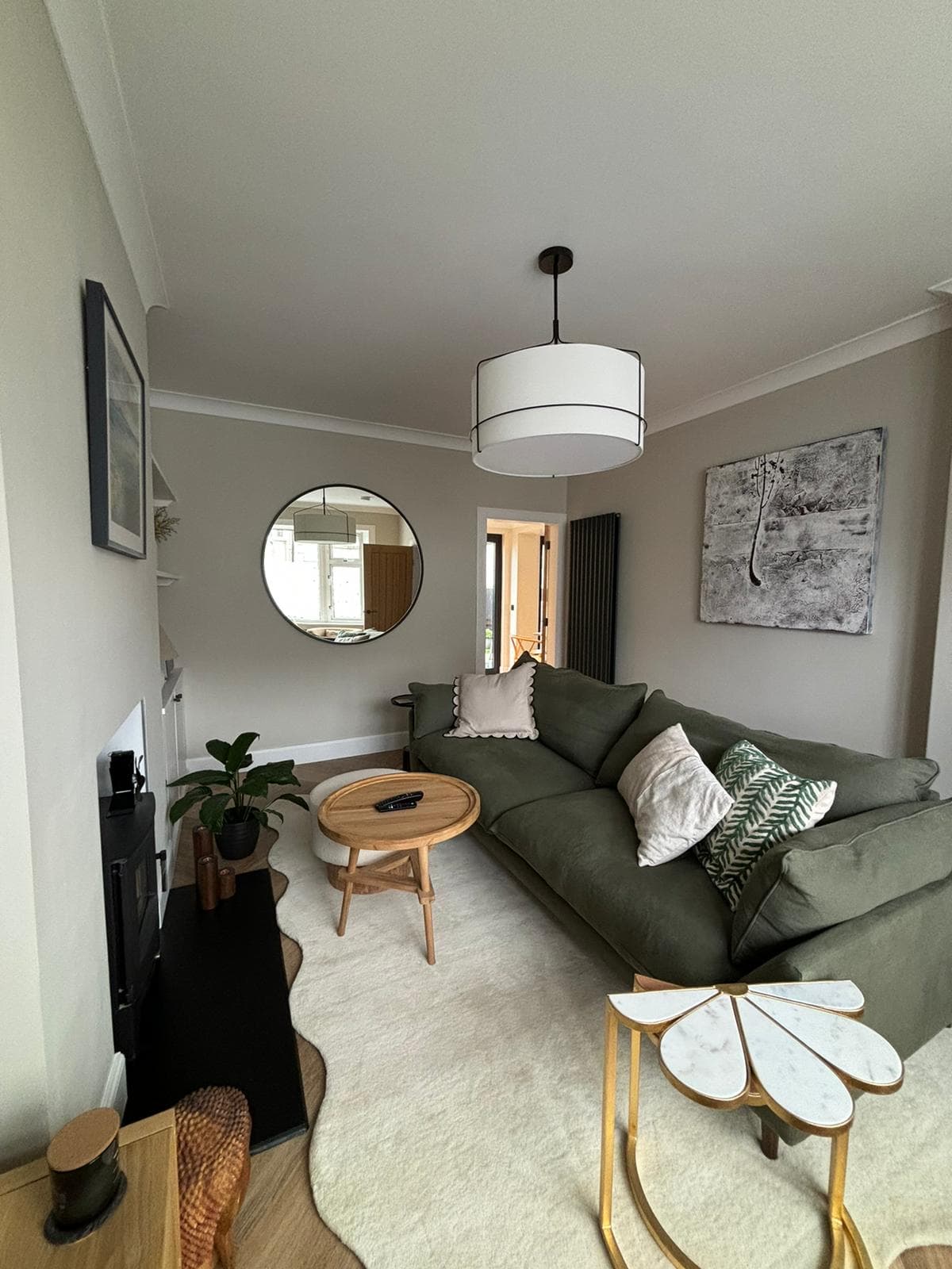 Spacious family lounge featuring built-in oak media wall and alcoves